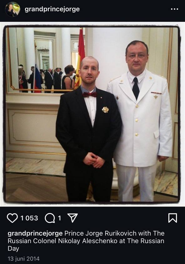 Screenshot of an Instagram post: a man in a tuxedo next to a man in a white Russian dress uniform.