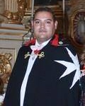 Félix Ramos in the order's mantle at an OSJ ceremony, cropped from the photo further down.